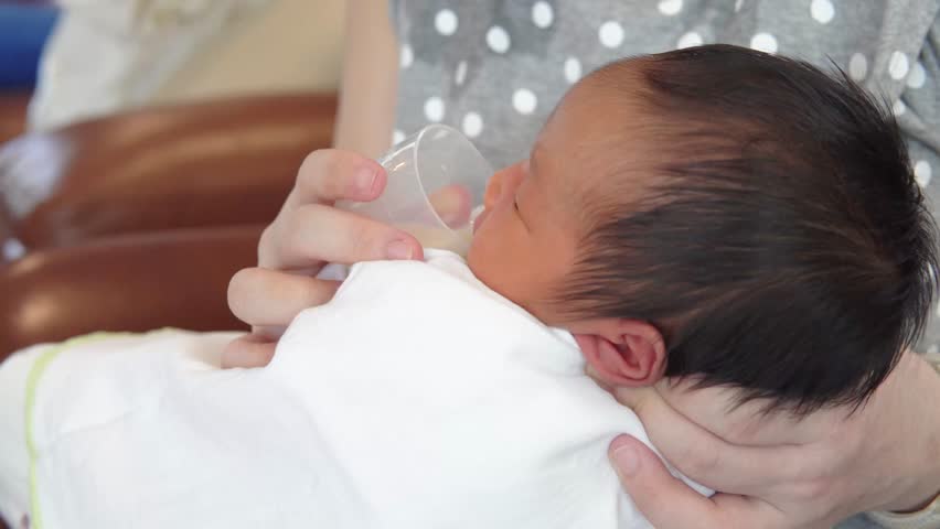 Baby Cup Feeding for Newborn. Stock Footage Video (100