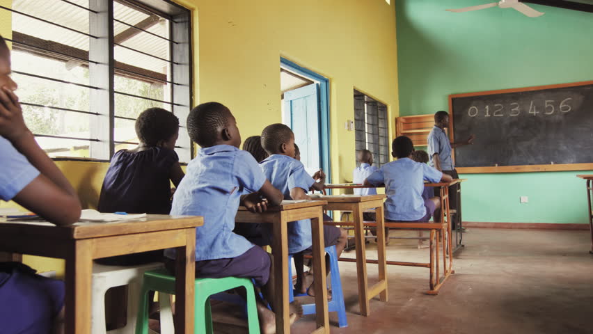 4k Of African Pupils Raising Hand In Class To Answer Teachers Mathematics Question 4k Of African Pupils Raising Hand In Class To Answer Teachers Mathematics Question