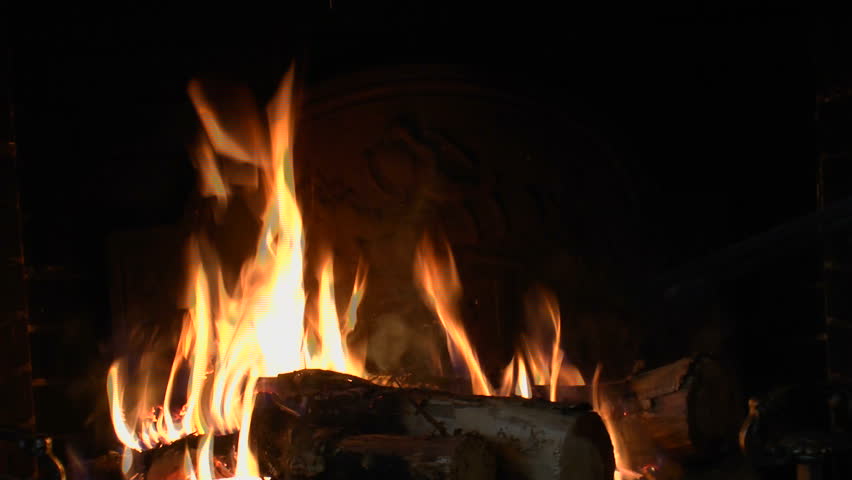 Hand Holds Fireplace Poker Pushes Stock Footage Video 100