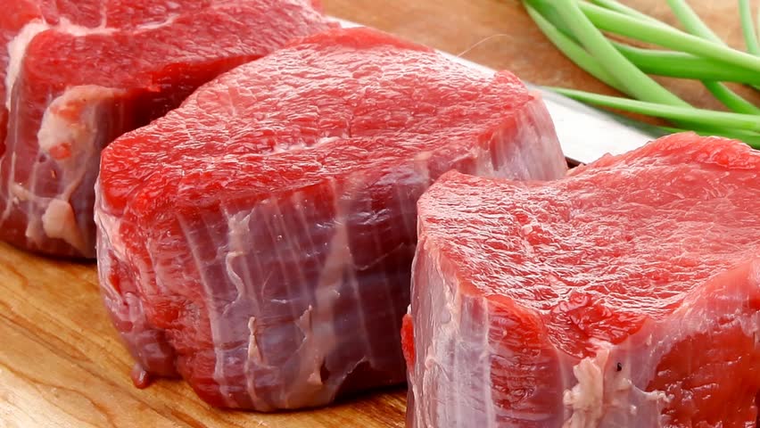 Raw Fresh Beef Meat Slices In A White Bowls With Onion And Red Peppers ...