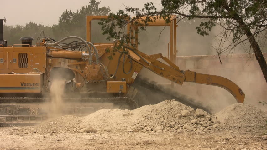 Stock Video Clip of Video closeup of large industrial ditch digger ...