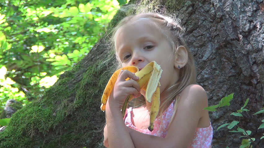 Child Eating A Banana Fruit In Forest Little Girl Attacked By A Bee