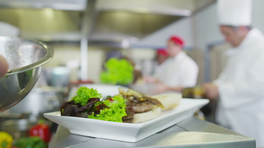 Restaurant Kitchen Video male chef in hotel or restaurant kitchen working and cooking meat Restaurant Kitchen Video male chef in hotel or restaurant kitchen working and cooking meat