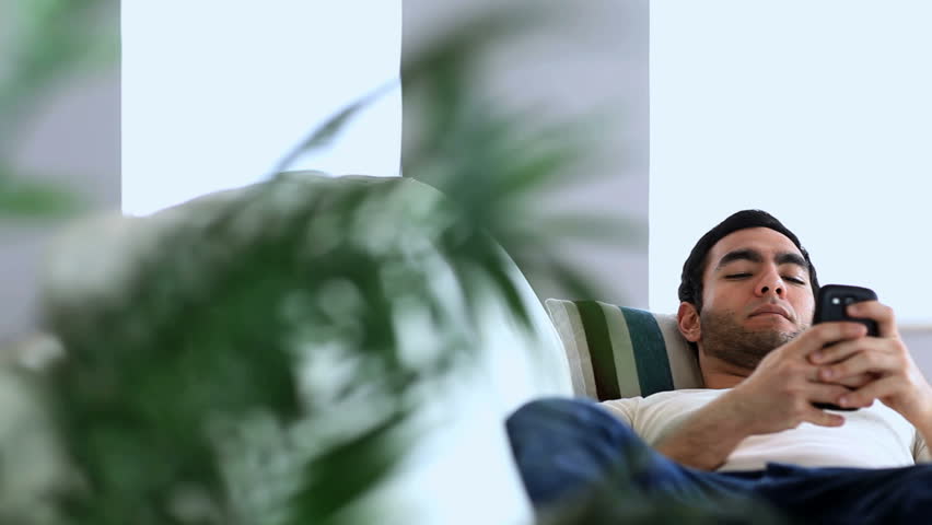 Man Using His Smartphone While Stock Footage Video 100 Royalty