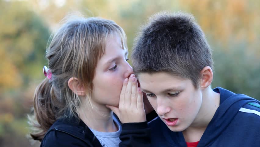 Whispers A Secret To The Boy Whispering In Ear Stock Footage