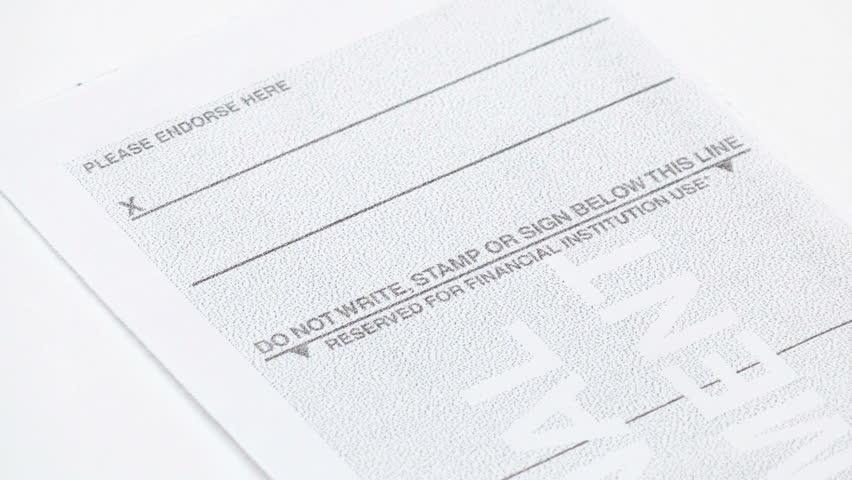 signing back of check stock footage video 100 royalty free 523819 shutterstock signing a check