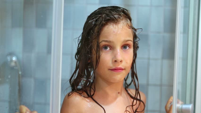 Stock video of little girl closes shower unit door ...