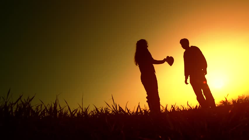 Happy Family Of Mother, Father And Little Child Walking Outside Holding ...