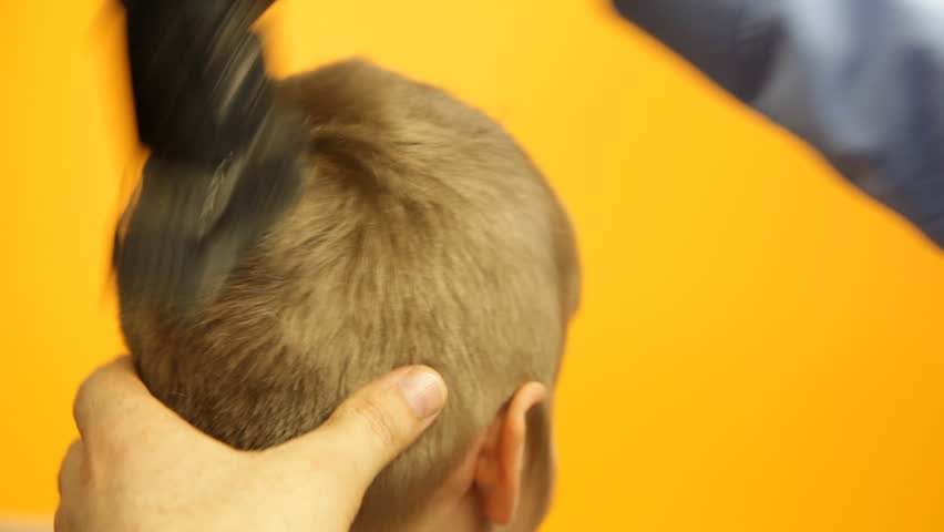 Stock video of young boy's hair being cut with  6103109 