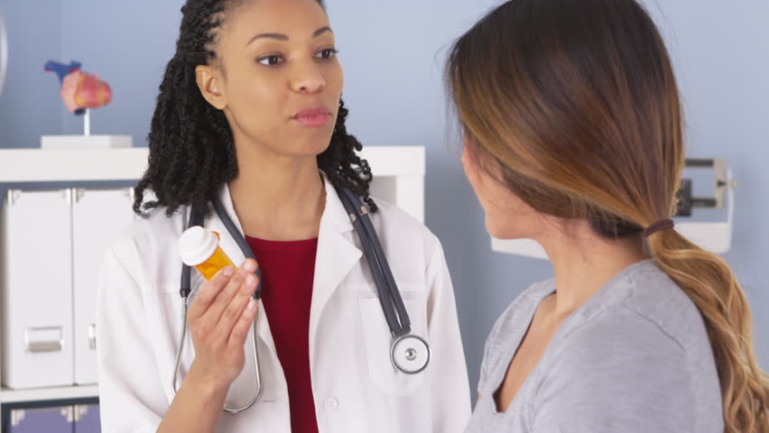 Female Multiracial Doctor Giving Prescription To Her Patient Stock ...