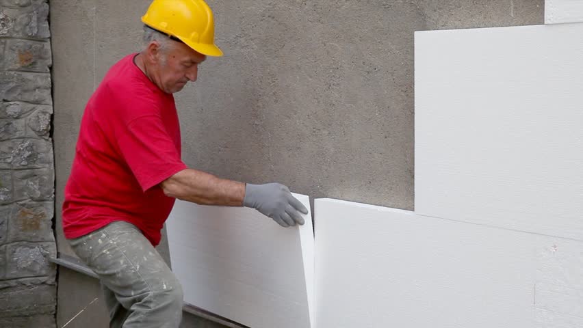Worker Placing Styrofoam Polystyren Sheet Stock Footage Video 100 Worker Placing Styrofoam Polystyren Sheet Insulation To Wall At Construction Site
