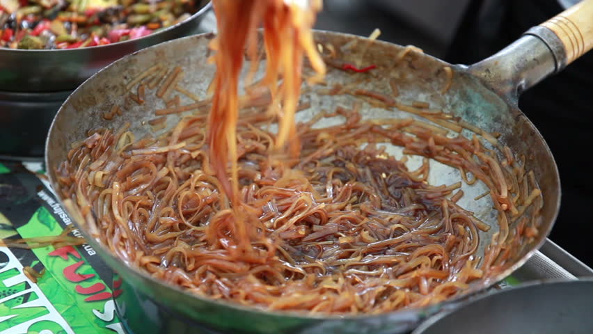 Stock video of street chef puts thai food in | 6975529 | Shutterstock