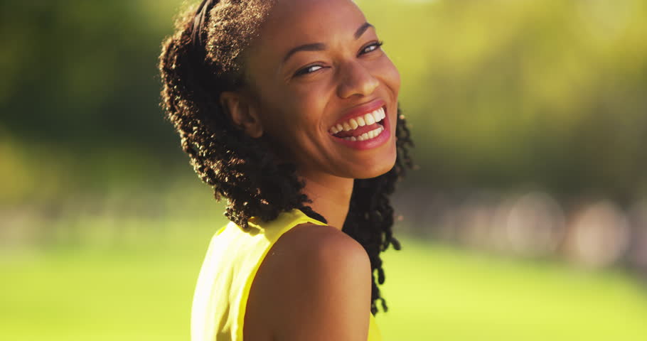 African Woman Eating An Ice Cream Cone At The Park Stock 