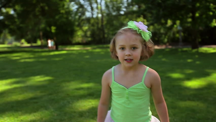 Stock video of cute little girl twirls and jumps | 7320169 | Shutterstock