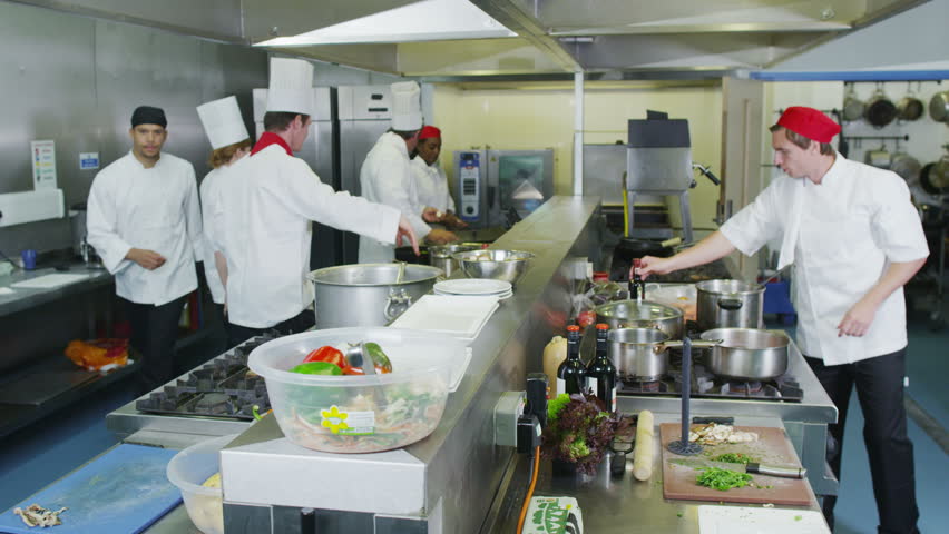 Restaurant Kitchen Video professional chefs in a restaurant or hotel kitchen. they are Restaurant Kitchen Video professional chefs in a restaurant or hotel kitchen. they are