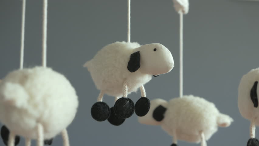 4k00 24lamb Nursery Mobile Spinning Above Baby Crib Close Up