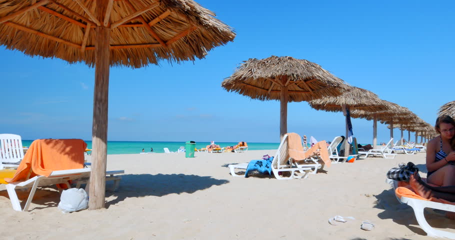 Thatched Beach Umbrella The Best Beaches In World Video Ultrahd Tourists Rest In The Shade Of Beach Umbrellas On