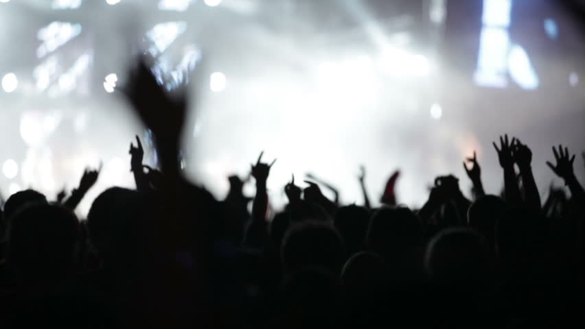 Crowd Of People Illuminated By Colorful Light During A Concert Stock ...