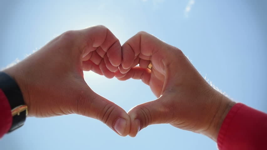 SLOW MOTION, CLOSE UP: Making Heart Sign With Hands Over Beautiful ...